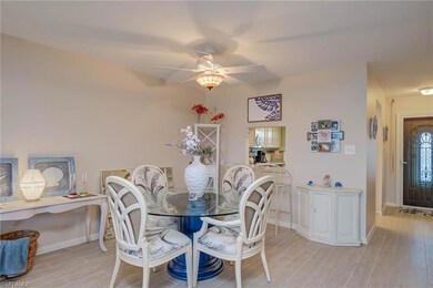 Dining room featuring wood finish floors and ceiling fan