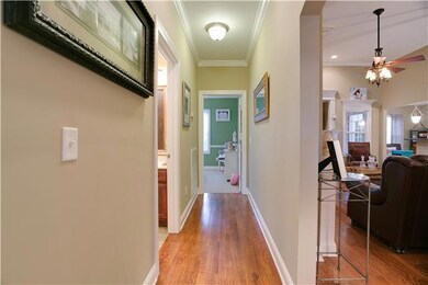 View from Bedroom #2 down hallway to Bedroom #3, look at those gorgeous floors and also has Bathroom off hallway