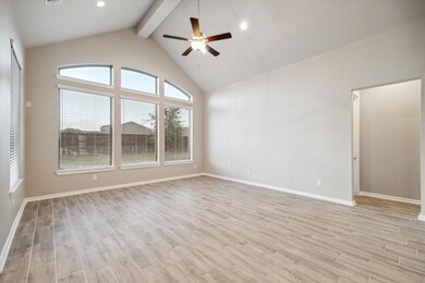 This is a spacious main LIVING ROOM with high 15'