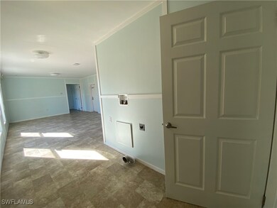 Laundry room with washer hookup and hookup for an electric dryer