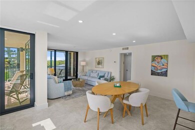 Dining room with recessed lighting and expansive windows