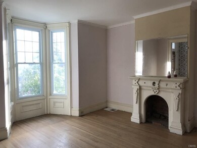Living room with bay window and fireplace