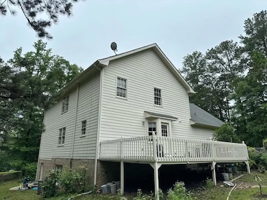 Rear view of house with a deck