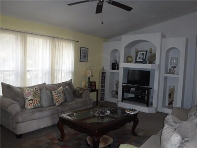 Living room with vaulted ceiling.