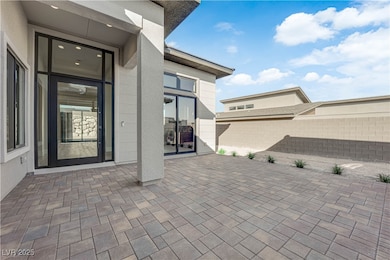 Fenced backyard with a patio
