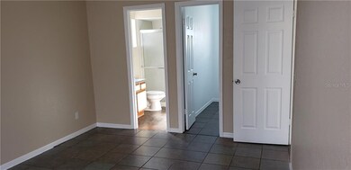 Master view of bathroom and closet