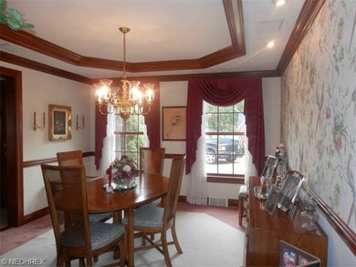 Spacious diningroom with tray ceiling, and crown m