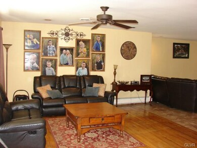 Living room with refinished hardwood floors.