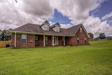 Cape cod house with a front lawn
