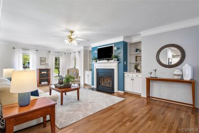 Gas fireplace is flanked by beautiful built-in cabinets.
