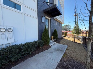 View of yard with fence and a balcony