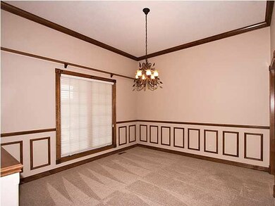 Spacious formal dining room for hosting those spec