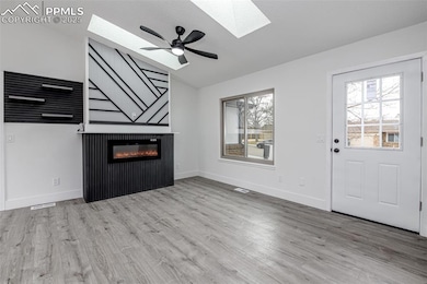 Unfurnished living room with a wealth of natural l