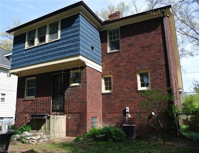 A view of this stately Tudor from the rear yard