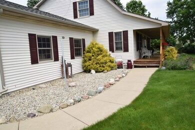 The driveway area leads into a walkway that takes you to the front entrance of the home.