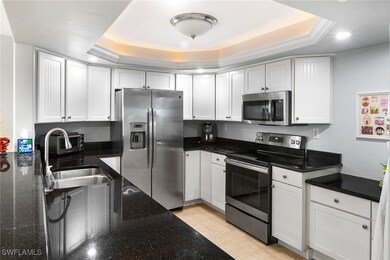 Kitchen with white cabinetry, stainless steel appl