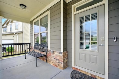 Doorway to property featuring a porch