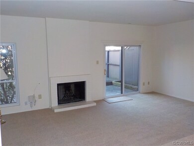 Living room with wood burning fireplace