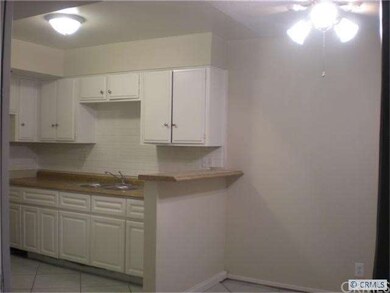 Kitchen and breakfast nook with ceiling fan