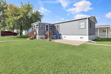 Manufactured / mobile home featuring a front yard, crawl space, and entry steps