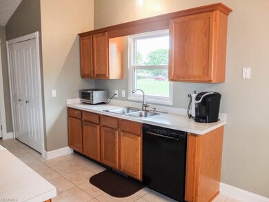 Kitchen has a new dishwasher and a large pantry wi