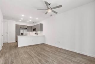 Unfurnished living room with wood finished floors
