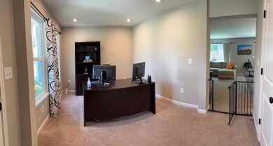 Carpeted office with recessed lighting and healthy amount of natural light