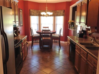 View of kitchen looking into breakfast area 