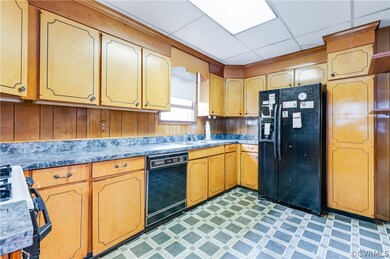 kitchen showing nice cabinets dishwasher and refidgerator