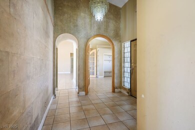 Corridor with a towering ceiling, arched walkways,
