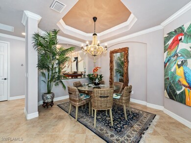 Dining space with crown molding, baseboards, visible vents, and a chandelier