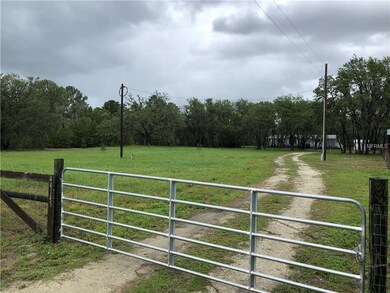 Gated fenced entrance to property.