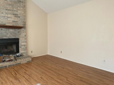 Unfurnished living room with wood finished floors