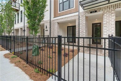 A gated front entry with fenced front yard equipped with irrigation and maintained by the HOA.