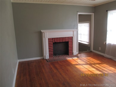 Cozy living room with wood floors and lots of ligh