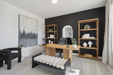 (Photos of model home, finishes will vary) A versatile flex space situated off the foyer is ideal for a home office, as shown here.