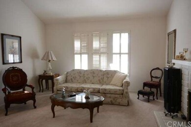 Ample size formal living room has scraped ceilings