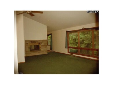 Formal living room with fireplace backing up to Fa