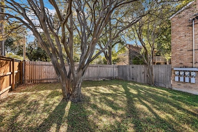 View of fenced backyard