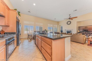 KITCHEN WITH VIEW OF FAMILY ROOM & BREAKFAST AREA