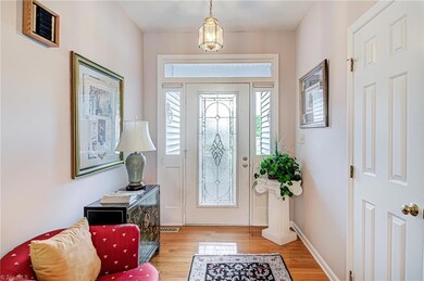 This beautiful foyer will greet you as you enter the home. Notice those gorgeous glass sidelite, transom, and door surround!