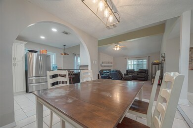 The dining area is conveniently connected to the kitchen.