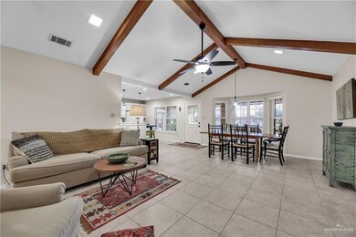 Living room featuring a ceiling fan, light tile patterned floors, and recessed lighting