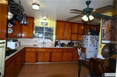 Family style kitchen with beautiful wood cabinets.