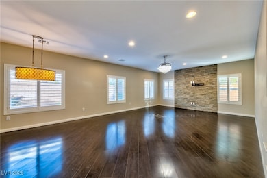 Unfurnished living room with a wealth of natural l