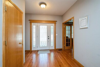 Front Foyer - den with french doors to the right.
