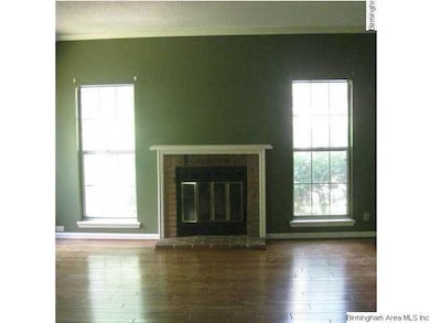 Living room has great hardwood floors, crown moldi