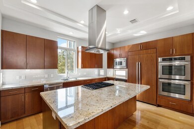 What a fabulous kitchen.  Huge granite island with