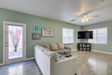 Living area featuring plenty of natural light, vis