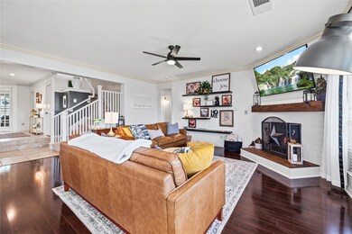 Spacious living room with updated fireplace and custom mantle.